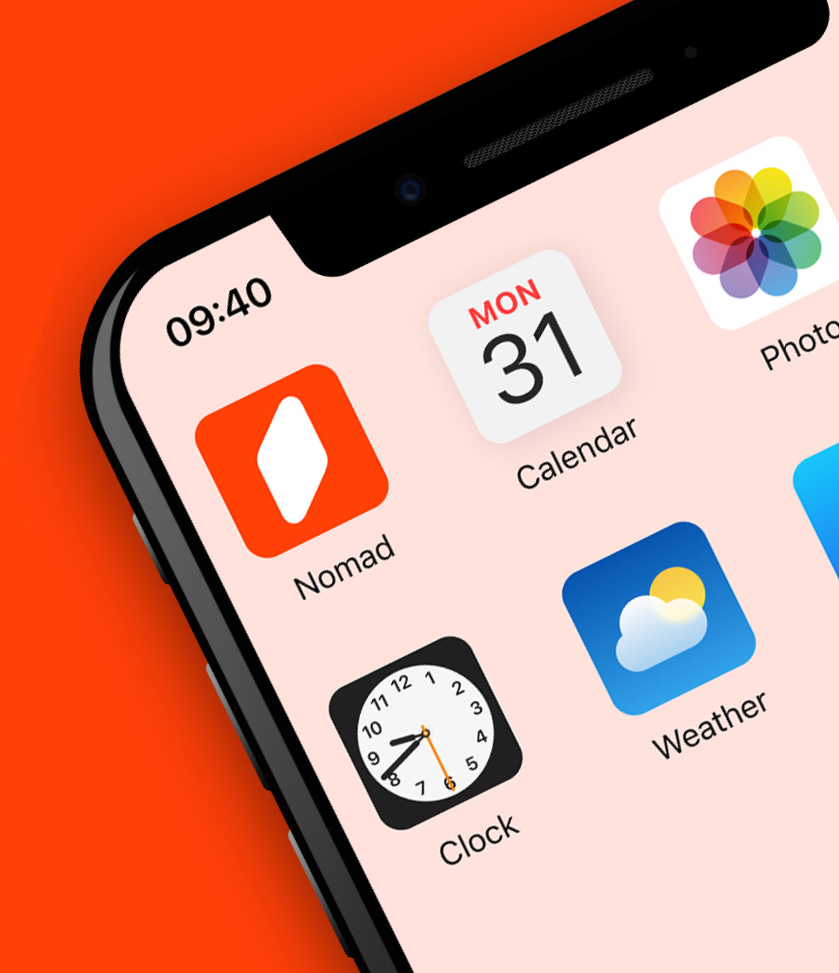 Close-up of a smartphone screen displaying app icons, including the Nomad app with an orange and white logo, alongside Calendar, Photos, Clock, and Weather apps. The phone's time reads 09:40, and the background is a bold orange color.