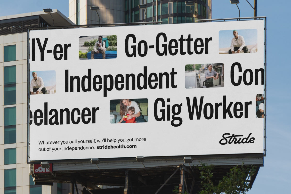 A digital billboard displays bold black text with words like 'Independent,' 'Freelancer,' and 'Go-Getter' highlighted in yellow, alongside small images of diverse individuals. The billboard promotes Stride Health, encouraging self-employed and gig workers to embrace independence.